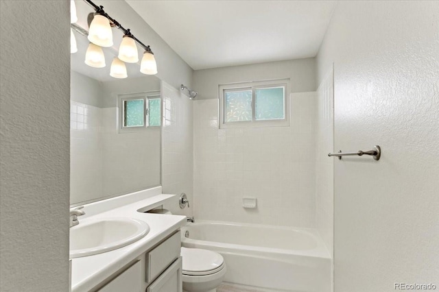 13244 Quivas St, Denver, CO 80234 - full bath with vanity, toilet, washtub / shower combination, and a textured wall