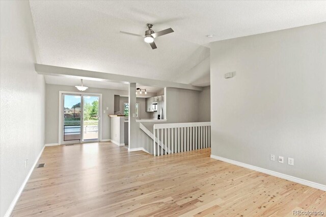 13244 Quivas St, Denver, CO 80234 - unfurnished room with wood finished floors, baseboards, a ceiling fan, and lofted ceiling