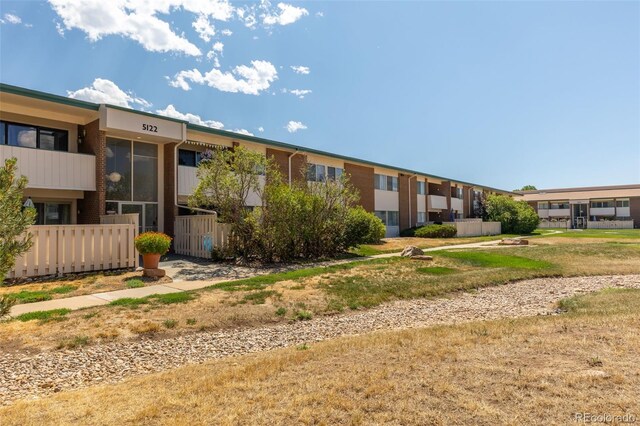 view of home's community featuring a yard