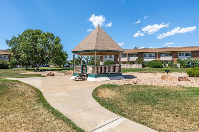 view of home's community with a gazebo and a yard