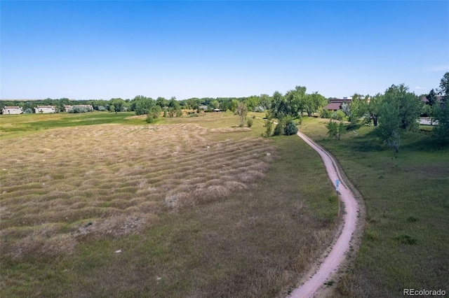 birds eye view of property with a rural view