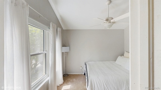 carpeted bedroom featuring baseboards and ceiling fan