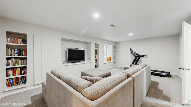 living area with carpet, built in shelves, baseboards, and recessed lighting