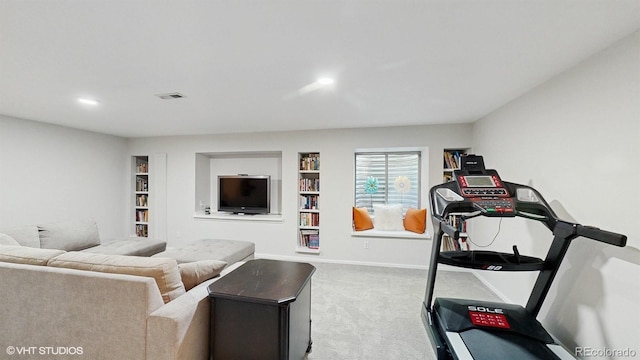 exercise room featuring carpet floors, built in features, recessed lighting, and baseboards