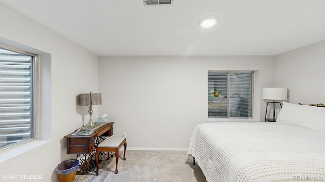 carpeted bedroom with baseboards