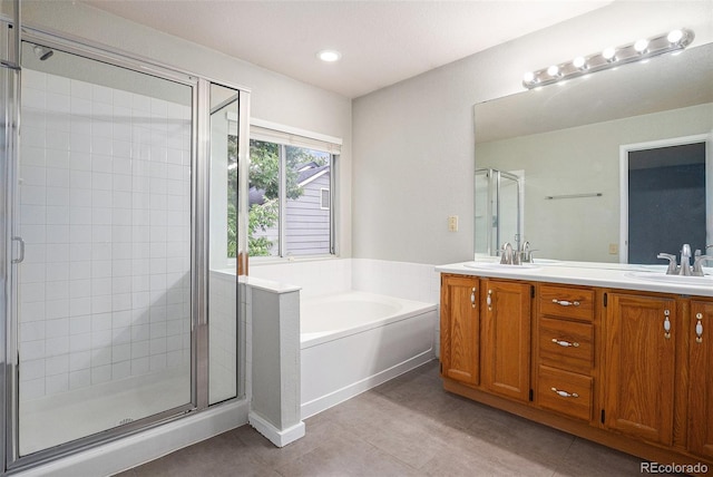 2786 S Cathay Way, Aurora, CO 80013 - bathroom featuring a shower stall, double vanity, a bath, and tile patterned flooring