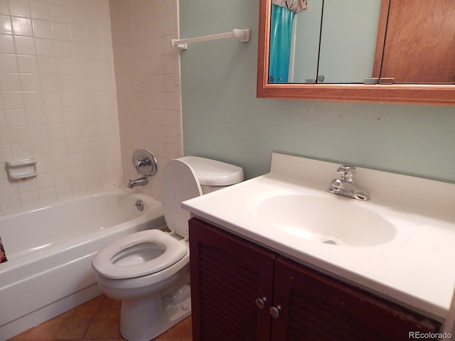 full bathroom featuring tiled shower / bath combo, toilet, tile patterned floors, and vanity