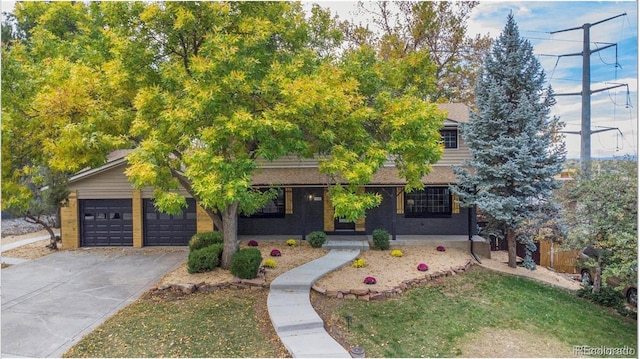 5720 E Caley Ave, Centennial, CO 80111 - view of property hidden behind natural elements with concrete driveway and an attached garage