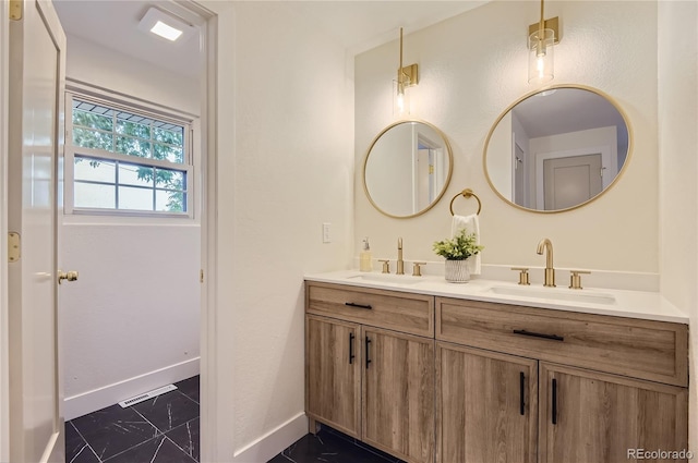 5720 E Caley Ave, Centennial, CO 80111 - bathroom featuring double vanity and marble finish flooring