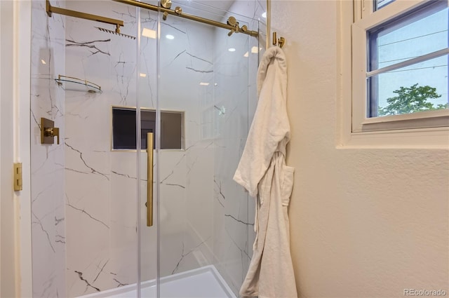 5720 E Caley Ave, Centennial, CO 80111 - full bath with a marble finish shower and a textured wall