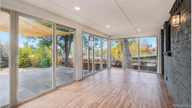 5720 E Caley Ave, Centennial, CO 80111 - unfurnished sunroom featuring wood finished floors and recessed lighting