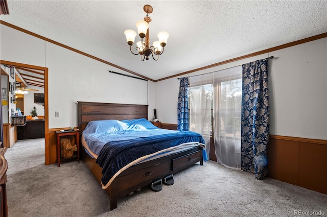 bedroom featuring wood walls, a textured ceiling, and vaulted ceiling