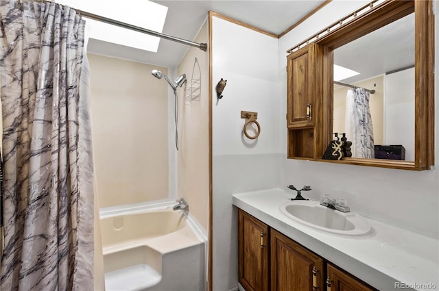 bathroom featuring shower / tub combo with curtain, vanity, and a skylight