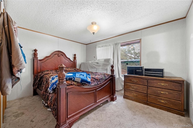 bedroom with a textured ceiling, light carpet, and crown molding