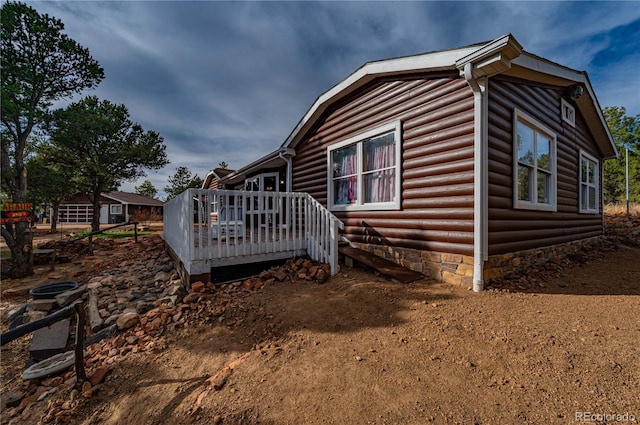 view of side of home featuring a deck