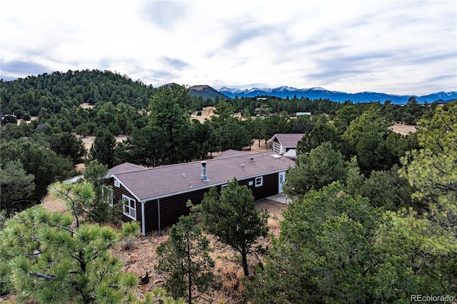 birds eye view of property with a mountain view