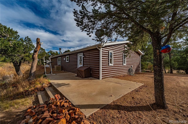 view of side of property featuring a patio