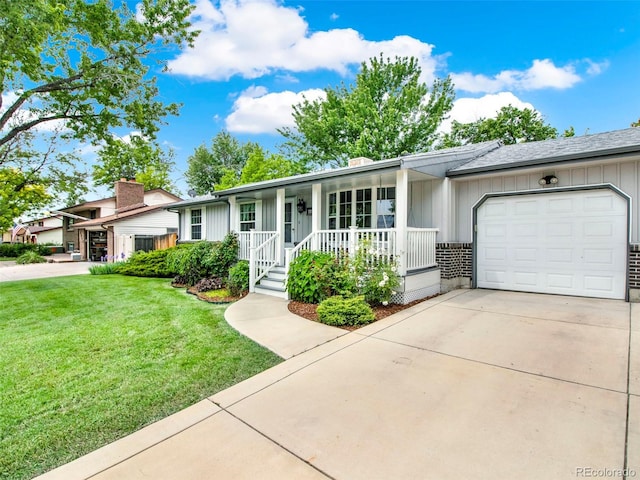 6943 Ingalls St, Arvada, CO 80003 - ranch-style house with covered porch, a garage, a front yard, concrete driveway, and board and batten siding