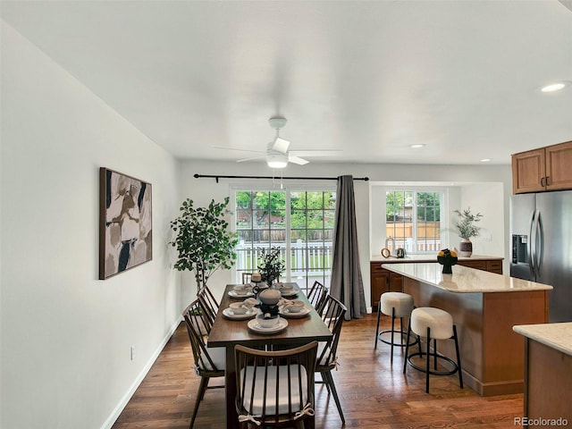 6943 Ingalls St, Arvada, CO 80003 - dining room featuring a ceiling fan, recessed lighting, dark wood-type flooring, and baseboards
