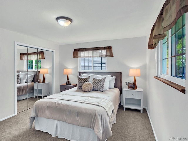 6943 Ingalls St, Arvada, CO 80003 - carpeted bedroom with multiple windows, a closet, and baseboards