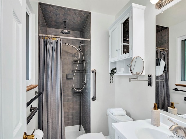 6943 Ingalls St, Arvada, CO 80003 - full bath featuring toilet, a stall shower, and vanity