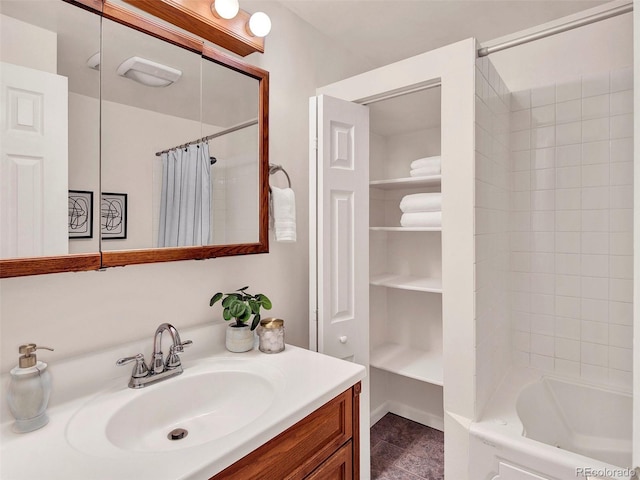 6943 Ingalls St, Arvada, CO 80003 - bathroom featuring vanity, shower / tub combo with curtain, and tile patterned floors