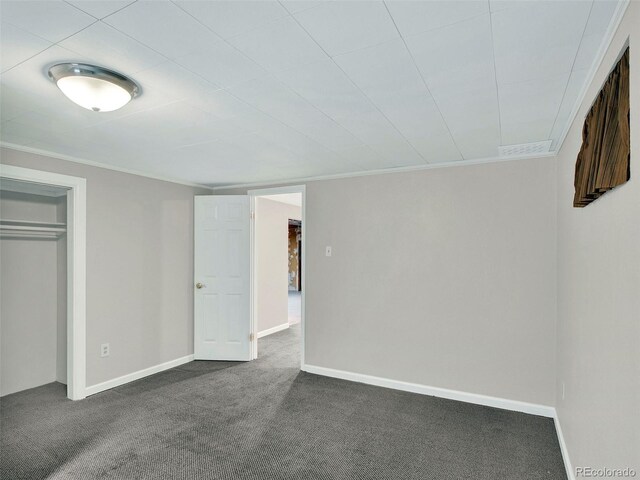 6943 Ingalls St, Arvada, CO 80003 - unfurnished bedroom with dark colored carpet, crown molding, a closet, and baseboards