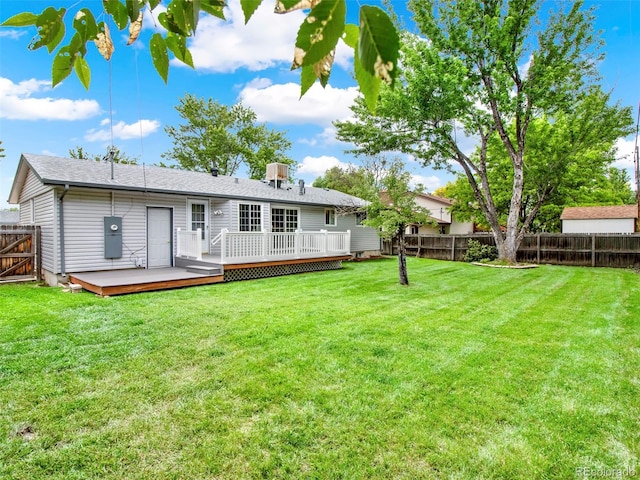 6943 Ingalls St, Arvada, CO 80003 - rear view of house with a wooden deck
