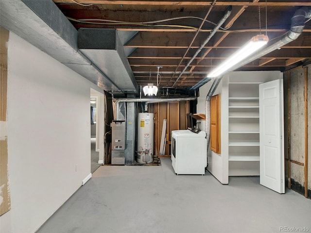 6943 Ingalls St, Arvada, CO 80003 - unfinished basement featuring washer / dryer, gas water heater, and heating unit