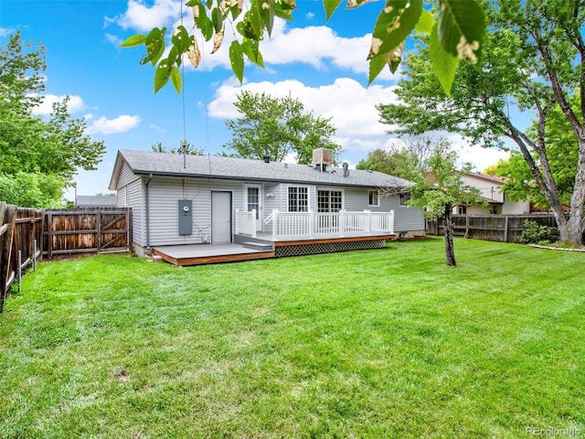 6943 Ingalls St, Arvada, CO 80003 - rear view of house with a wooden deck