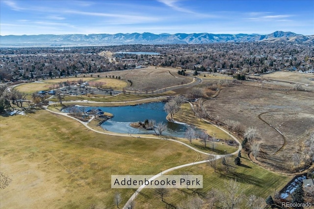 birds eye view of property with a water and mountain view