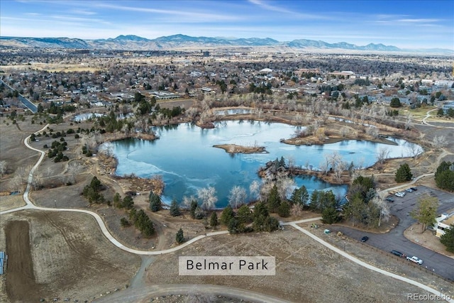 bird's eye view with a water and mountain view