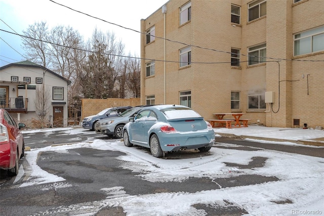 view of snow covered parking