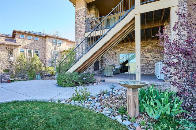 view of patio / terrace featuring stairway