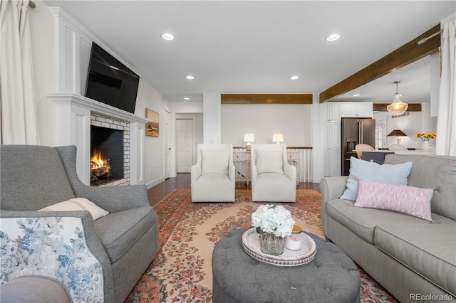 21 Fairway Ln, Littleton, CO 80123 - living area with recessed lighting, a fireplace, wood finished floors, beamed ceiling, and baseboards