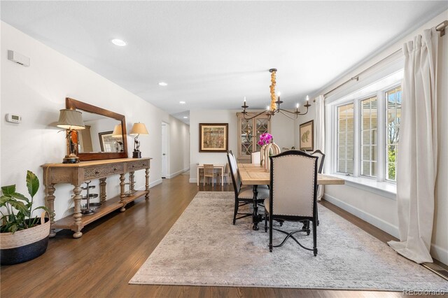 21 Fairway Ln, Littleton, CO 80123 - dining space featuring wood finished floors, a chandelier, plenty of natural light, recessed lighting, and baseboards