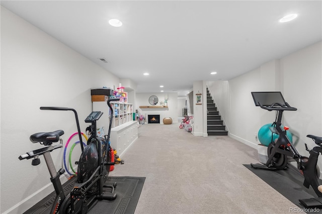 21 Fairway Ln, Littleton, CO 80123 - workout room featuring recessed lighting, a lit fireplace, baseboards, and carpet floors