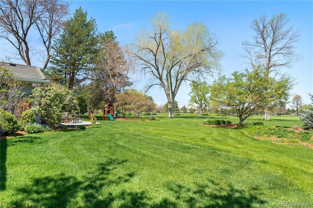 21 Fairway Ln, Littleton, CO 80123 - view of green lawn featuring a playground