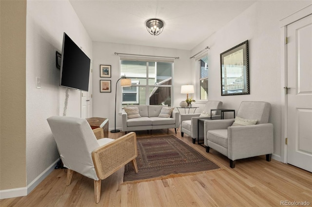 3670 Wolff St, Denver, CO 80212 - living area with light wood-style flooring and a chandelier