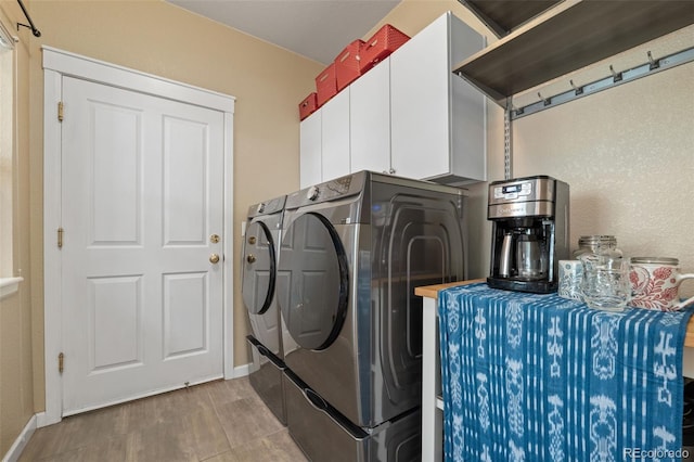 3670 Wolff St, Denver, CO 80212 - laundry room featuring independent washer and dryer, light wood-style flooring, and cabinet space