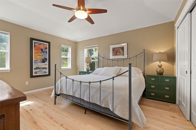 3670 Wolff St, Denver, CO 80212 - bedroom featuring a closet, light wood-style floors, vaulted ceiling, and a ceiling fan