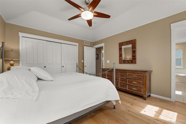 3670 Wolff St, Denver, CO 80212 - bedroom with light wood-type flooring, a closet, a ceiling fan, and ensuite bathroom