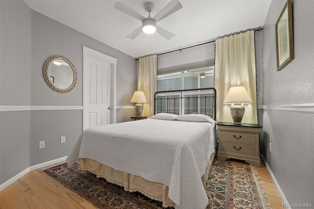 3670 Wolff St, Denver, CO 80212 - bedroom with wood finished floors, a textured wall, and a ceiling fan