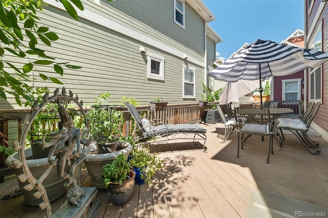 3670 Wolff St, Denver, CO 80212 - wooden deck with outdoor dining area