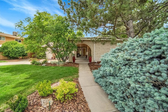 11496 E Wesley Ave, Aurora, CO 80014 - view of property hidden behind natural elements featuring brick siding and concrete driveway