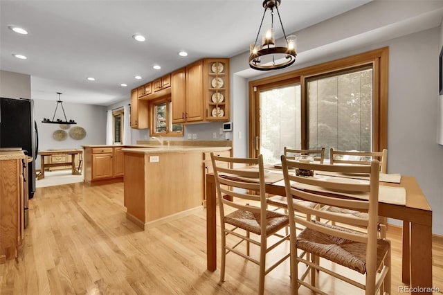 11496 E Wesley Ave, Aurora, CO 80014 - dining space featuring light wood-style floors, recessed lighting, and a chandelier
