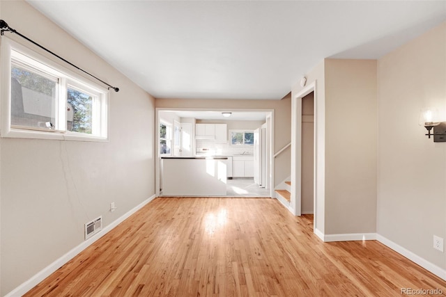 spare room with light wood-type flooring