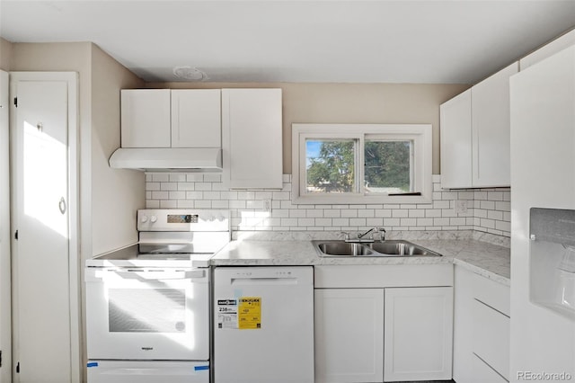 kitchen with white appliances, white cabinetry, tasteful backsplash, and sink