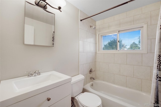 full bathroom featuring vanity, shower / tub combo, and toilet