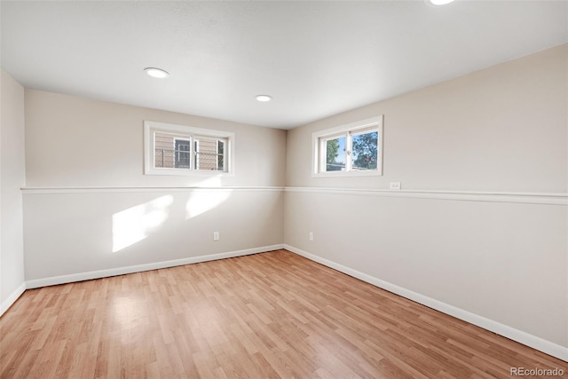 spare room featuring light hardwood / wood-style floors